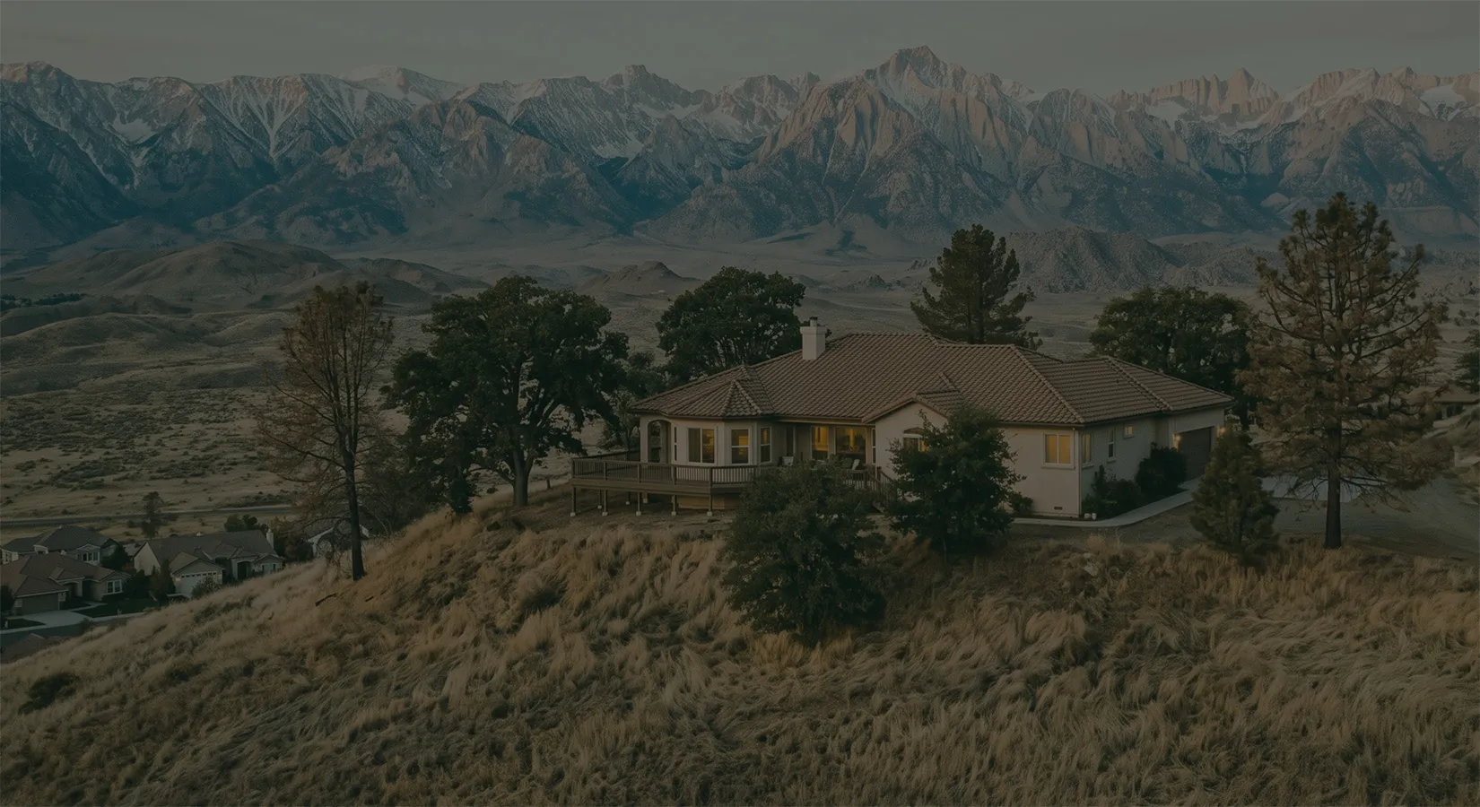 An umbrella sheltering a house, representing a last-resort insurance backstop